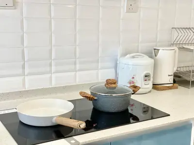 a pot on a stove top in a kitchen at Continew Residence by Shuen in Kuala Lumpur