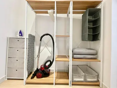 a room with a vacuum cleaner in a closet at Continew Residence by Shuen in Kuala Lumpur