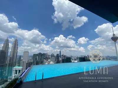 a view of the city from the rooftop of a skyscraper at The Platinum 2 Kuala Lumpur by LUMA in Kuala Lumpur
