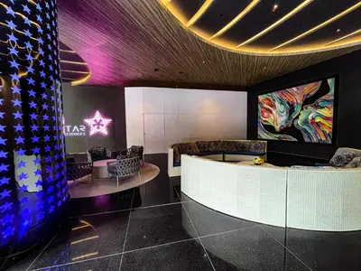 a lobby with a waiting room with a table and chairs at STAR RESIDENCE KLCC in Kuala Lumpur
