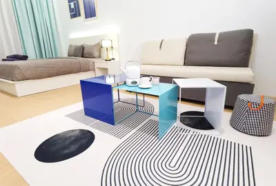 a living room with a table and a couch at The Blueprint @ Bangsar South Mid Valley in Kuala Lumpur