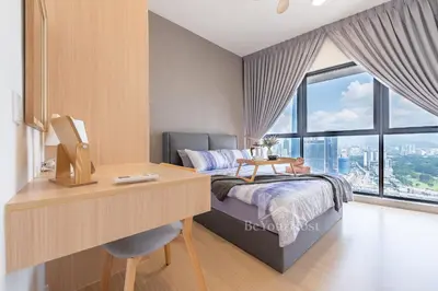 a bedroom with a desk and a bed with a window at Continew Residences Kuala Lumpur in Kuala Lumpur