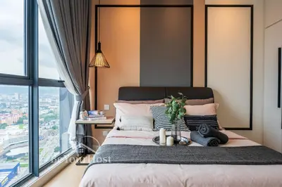 a bedroom with a bed with a large window at Continew Residences Kuala Lumpur in Kuala Lumpur