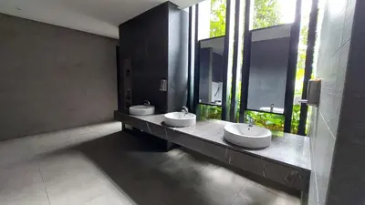 a bathroom with two sinks and two windows at Anggun Platinum Suites in Kuala Lumpur