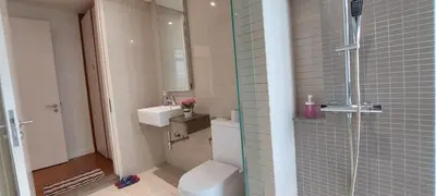 a bathroom with a shower and a toilet and a sink at Anggun Platinum Suites in Kuala Lumpur