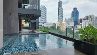 a swimming pool with a view of the city at Anggun Platinum Suites in Kuala Lumpur