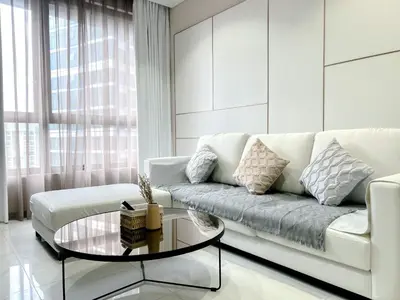 a living room with a white couch and a glass table at 8 Kia Peng Residence Kuala Lumpur by Scape Stay in Kuala Lumpur