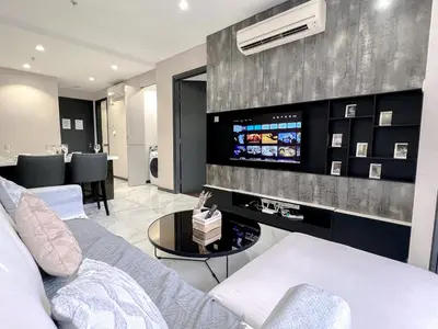a living room with a couch and a tv at 8 Kia Peng Residence Kuala Lumpur by Scape Stay in Kuala Lumpur