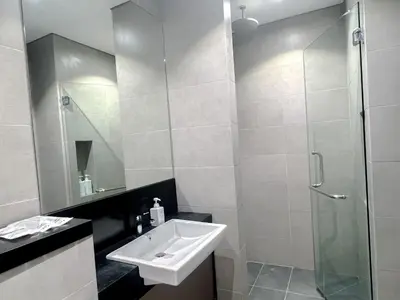 a bathroom with a sink and a shower at 8 Kia Peng Residence Kuala Lumpur by Scape Stay in Kuala Lumpur