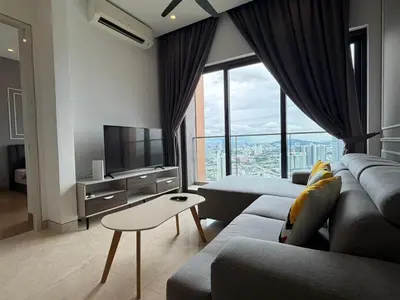 a living room with a couch and a tv at Lucentia Residence BBCC Lalaport at Kuala Lumpur By Luxe Home in Kuala Lumpur