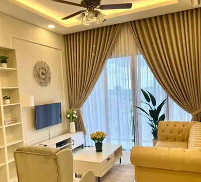 a living room with a couch and a television at Millerz Suite 3R2B Condo Near MidValley 3 Beds 3 Bedrooms Staycation Best Choice in Kuala Lumpur