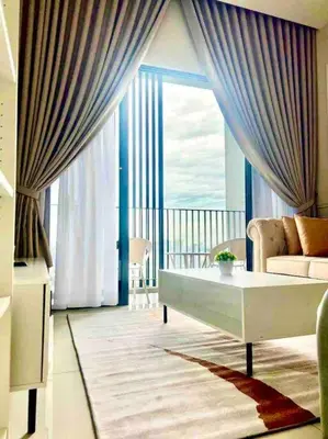 a living room with a couch and a large window at Millerz Suite 3R2B Condo Near MidValley 3 Beds 3 Bedrooms Staycation Best Choice in Kuala Lumpur