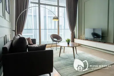 a living room with a couch and a table at Fairlane Residences by Plush in Kuala Lumpur