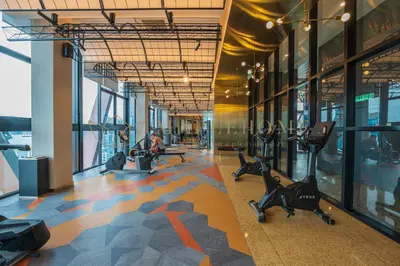 a gym with exercise equipment in a building at Scarletz Premier Suites Kuala Lumpur in Kuala Lumpur
