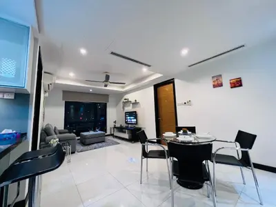 a living room with a table and chairs at CozyHome Suites @ Casa Residency in Kuala Lumpur