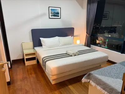a bedroom with a bed with a stuffed animal on it at CozyHome Suites @ Casa Residency in Kuala Lumpur