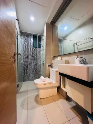 a bathroom with a toilet and a sink and a shower at CozyHome Suites @ Casa Residency in Kuala Lumpur