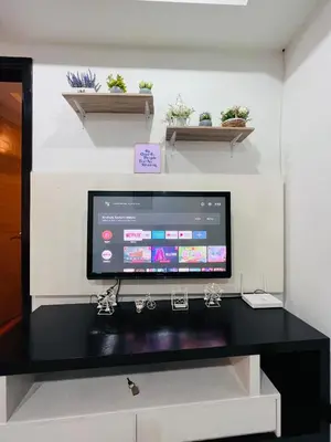 a flat screen tv sitting on top of a desk at CozyHome Suites @ Casa Residency in Kuala Lumpur