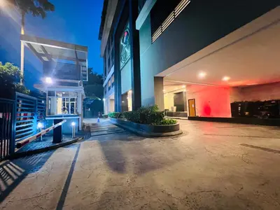 a building with a lit up courtyard at night at CozyHome Suites @ Casa Residency in Kuala Lumpur
