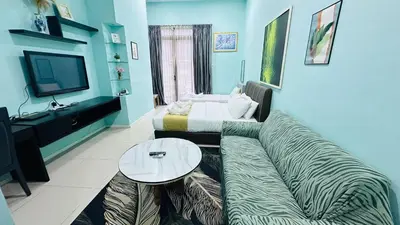 a living room with a couch and a table at Taragon Homestay - Kuala Lumpur, Malaysia in Kuala Lumpur