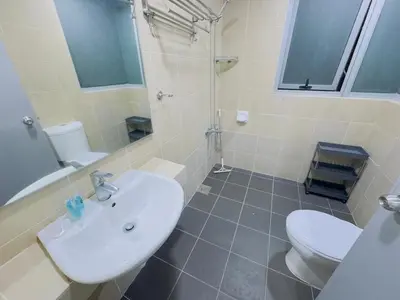 a bathroom with a white sink and a toilet at Taragon Homestay - Kuala Lumpur, Malaysia in Kuala Lumpur