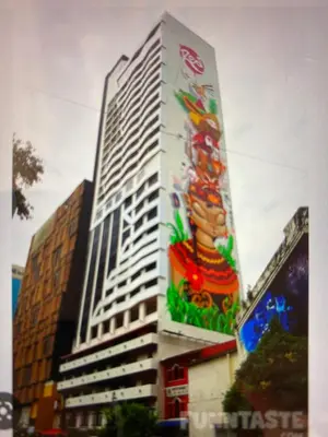 a building with a painting on the side of it at The RED in Kuala Lumpur