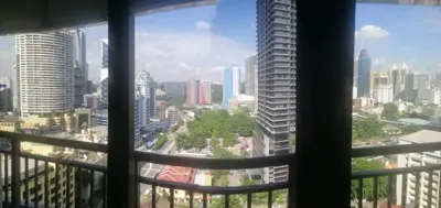a view of a city skyline from a window at The RED in Kuala Lumpur