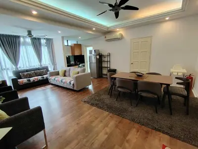 a living room with a dining room table and a couch at Fahrenheit 88 Suites Bukit Bintang H 3R in Kuala Lumpur