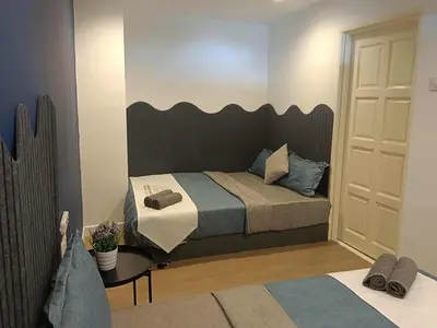 a bedroom with a bed with a large headboard at Fahrenheit 88 Suites Bukit Bintang H 3R in Kuala Lumpur