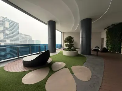 a room with a large window with a bench in a building at Eaton suites KLCC at KL in Kuala Lumpur
