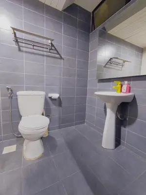 a bathroom with a toilet and a sink at AJ-HOME Fahrenheit 88 Pavillion Bukit Bintang 8pax in Kuala Lumpur