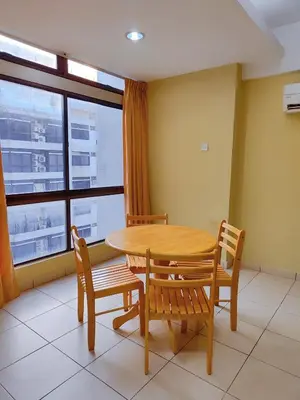 a dining room with a table and chairs and a window at AJ-HOME Fahrenheit 88 Pavillion Bukit Bintang 8pax in Kuala Lumpur