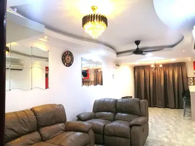 a living room with a couch and a chandelier at Apartment Low Cost 2 Bilik Asnor Homestay KL in Kuala Lumpur