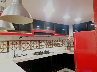 a kitchen with white counters and blue cabinets at Apartment Low Cost 2 Bilik Asnor Homestay KL in Kuala Lumpur