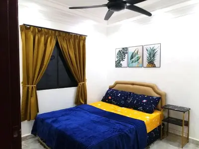 a bedroom with a bed and a ceiling fan at Apartment Low Cost 2 Bilik Asnor Homestay KL in Kuala Lumpur