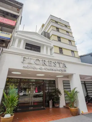 a hotel building with plants in front of it at Floresta Hotel Chinatown in Kuala Lumpur