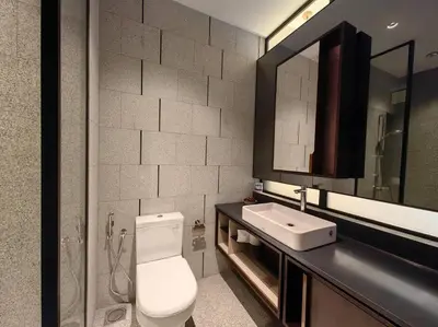 a bathroom with a toilet and a sink and a mirror at Scarletz Suites by Stevvy KL Home Stay in Kuala Lumpur
