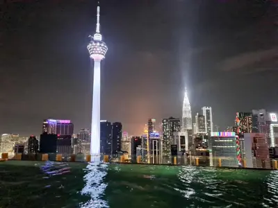 a view of the oriental pearl tower at night at Romantic Log Cabin - walk to KL Tower, KLCC, Bukit Bintang in Kuala Lumpur