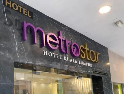 a hotel sign on the side of a building at Metrostar Hotel Kuala Lumpur in Kuala Lumpur