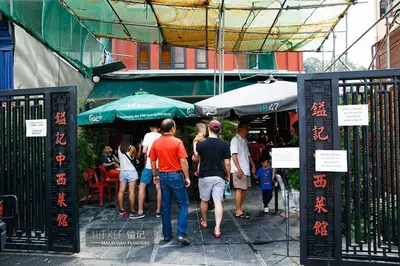 a group of people standing outside of a restaurant at ComfyHomes M101 Dang Wangi Pool KLCC View in Kuala Lumpur