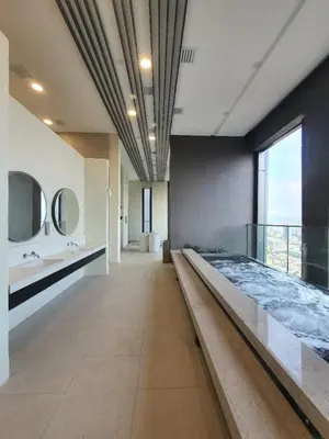 a large bathroom with a large bed and mirrors at Maxhome Plus at Lucentia Bukit Bintang City centre KL in Kuala Lumpur