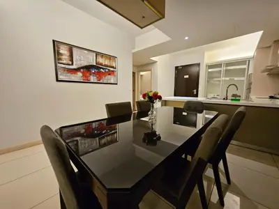 a dining room table and chairs in a kitchen at The Wisdom Apartment in Kuala Lumpur