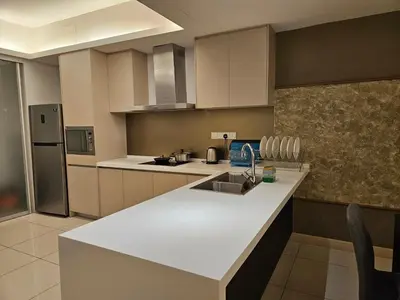 a kitchen with a sink and a counter top at The Wisdom Apartment in Kuala Lumpur