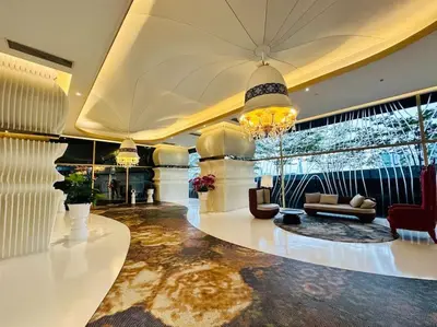 a large room with a lobby with couches and a chandelier at Diamond Home Comfort @ Arte Mont Kiara in Kuala Lumpur