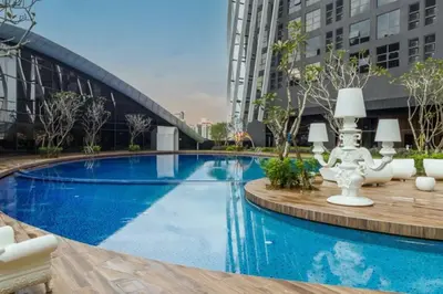 a large swimming pool in a city with buildings at Diamond Home Comfort @ Arte Mont Kiara in Kuala Lumpur