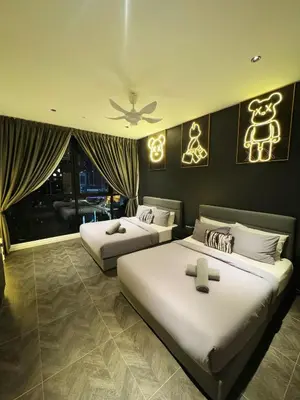 a bedroom with two beds and a ceiling fan at Luxury Scarletz Suite KLCC in Kuala Lumpur