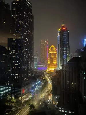 a city skyline at night with buildings and traffic at Luxury Scarletz Suite KLCC in Kuala Lumpur