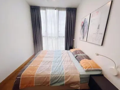 a bedroom with a large bed with a window at [PROMO]Connected train 2 Bedroom (ABOVE MALL)15 in Kuala Lumpur