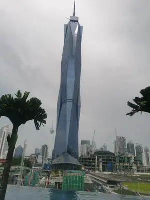 a tall building with a view of a city at Opus Residences KL 118 View in Kuala Lumpur