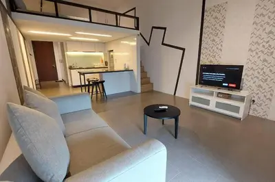 a living room with a couch and a tv at KL Sentral, EST Bangsar #9, 4Pax in Kuala Lumpur